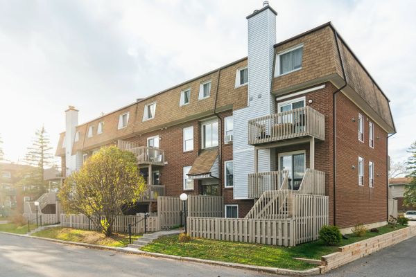 Sunny picture of a brick apartment building