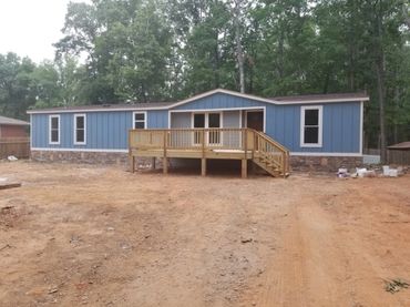 House after siding remodel and deck construction