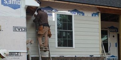 Siding and roof being installed