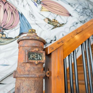 Custom mural in stairway in Mossbrae Hotel located in Dunsmuir, CA
