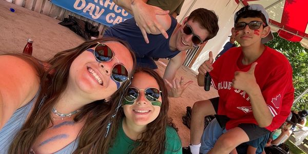 teens in sunglasses taking a selfie and smiling at Richmond Hill Country Club camp