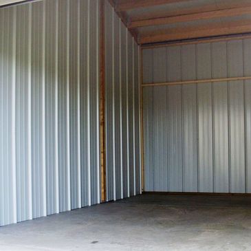 Safe-N-Secure Storage Rochester MN inside a storage rental unit. A frame roof with concrete floors. t