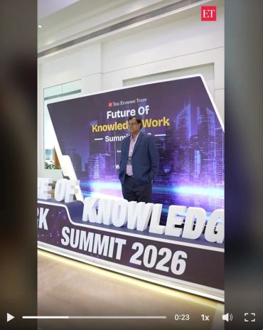 Man posing at Future of Knowledge Work Summit 2026 event.