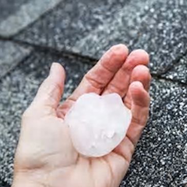 hand holding a hail stone