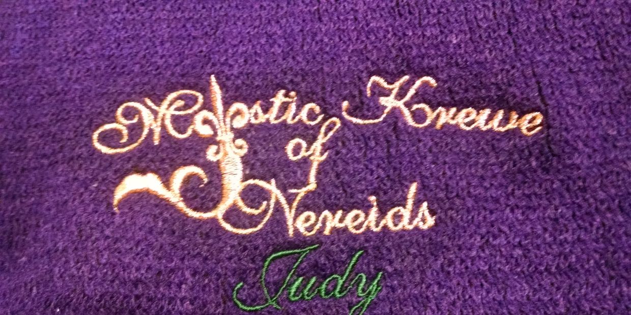 This is a Mardi Gras krewe design which I embroidered on beautiful, purple, knit capes.