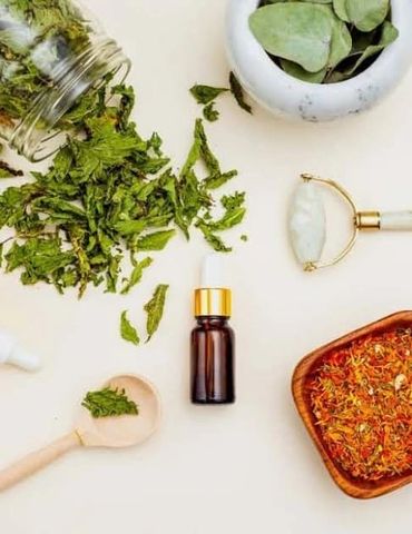 Jade roller, essential skin care tools, oils and natural ingredients