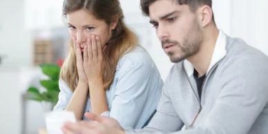 couple stressed from debt