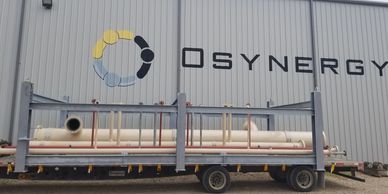 A  modular piping skid package next to the Osynergy building