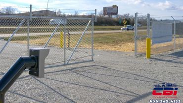 Automatic chain link gate opening at an RV and boat storage facility.