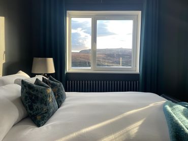 Bedroom with a view of Storr Lochs. Storr Apartments - Fada Apartmant.