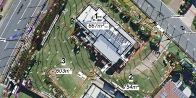 Aerial view of a residential area with property boundaries and land measurements.