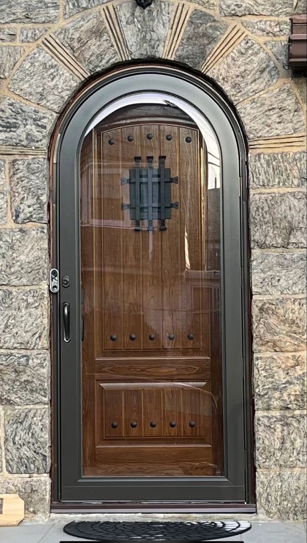 Arch top entrance fiberglass doors and full view round top storm door.