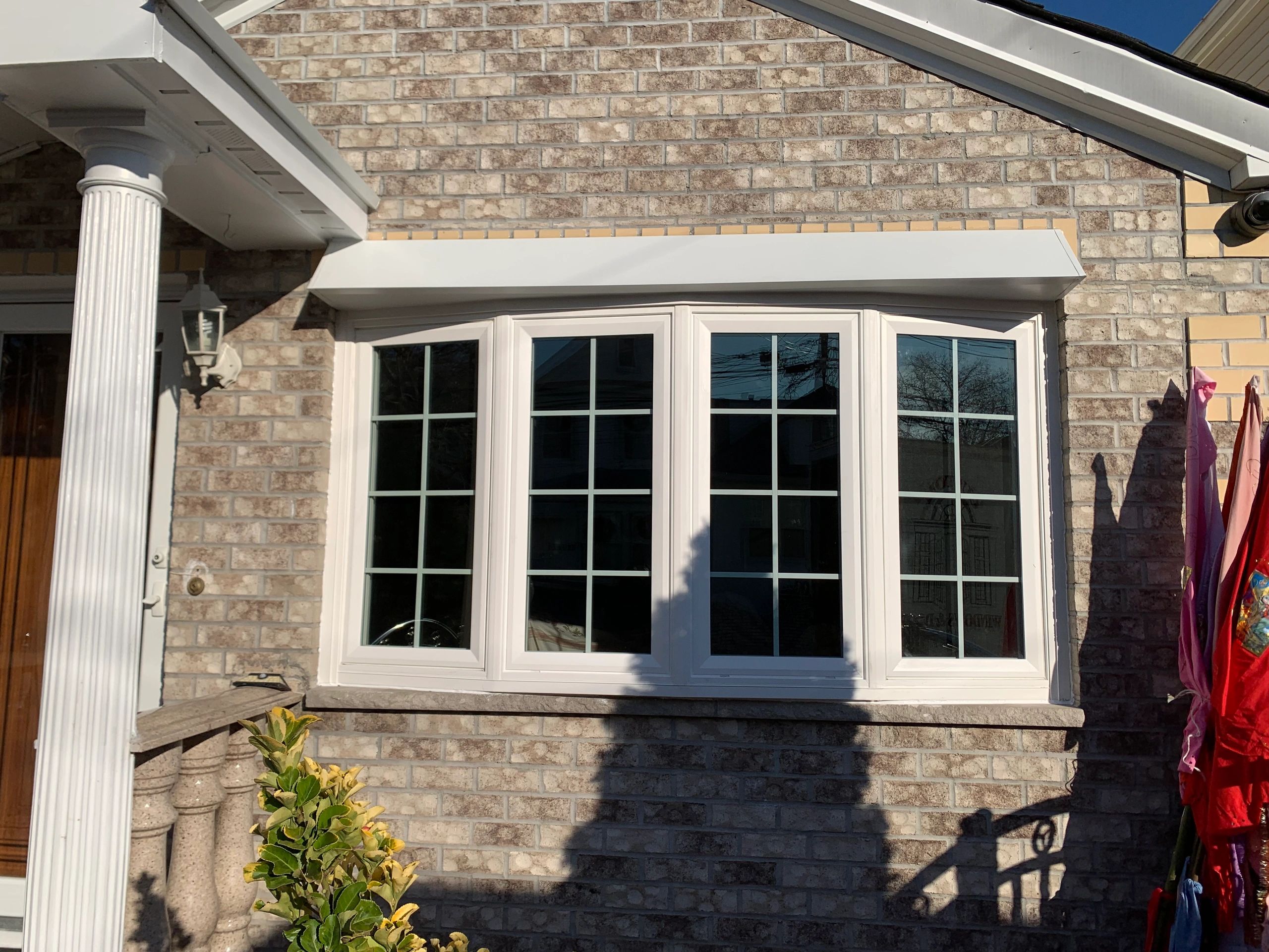 Bow window with colonial grits in all vents.