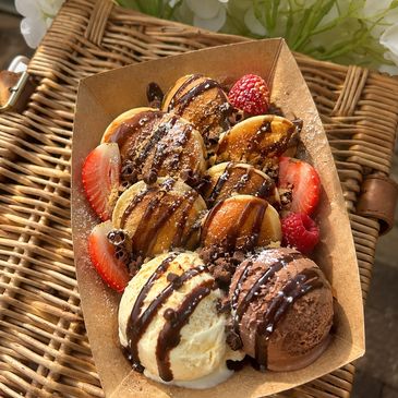 Fluffy waffle bites with gelato and fresh strawberries