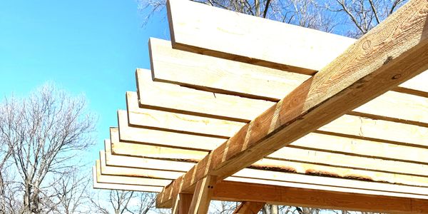 a custom built pergula with the sky behind it