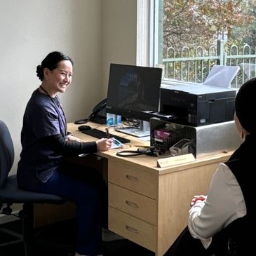 Dr Selina Lim specialist integrative medicine GP, doctor consulting patients at Professor Yoland Lim