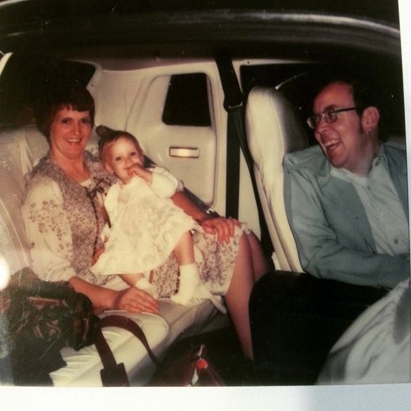 Janie on Mom's lap in Dad's Green Chrysler Cordoba