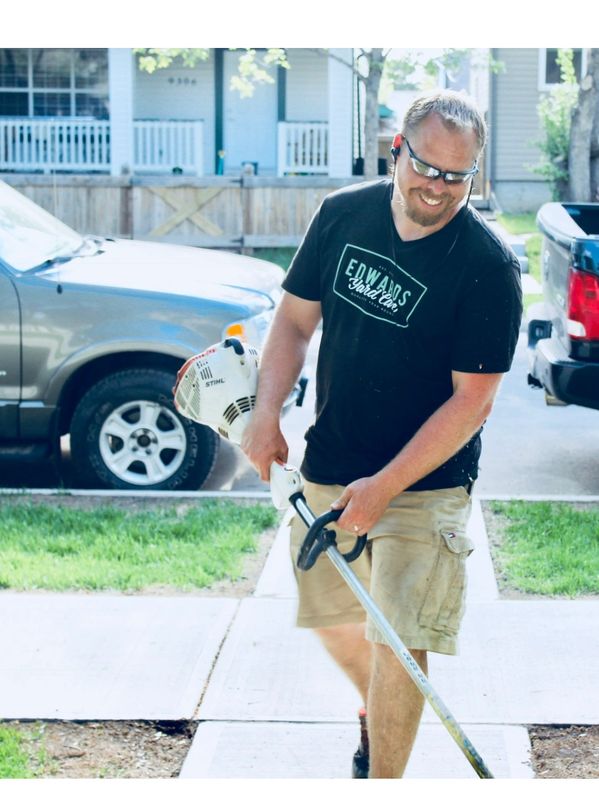 Mark at Edwards Yard Care whipper snippering.