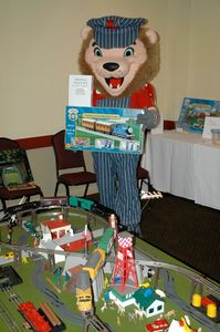 a man holding a toy banner