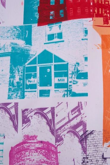 Part of a banner: screenprinted photos on white fabric. Photos of brickwork, mill buildings & detail