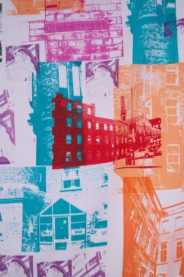 Part of a banner: screenprinted photos on white fabric. Photos of brickwork, mill buildings & detail