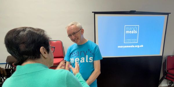 Roy from Mary's Meals talking to Beryl