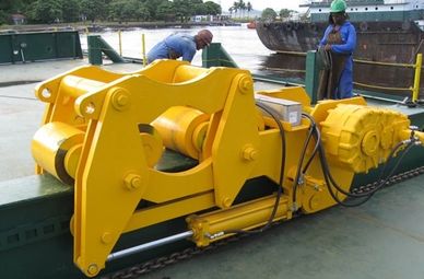 Barge-Mounted Conductor Shuttle System. Offshore use for installing conductors on ocean floor.