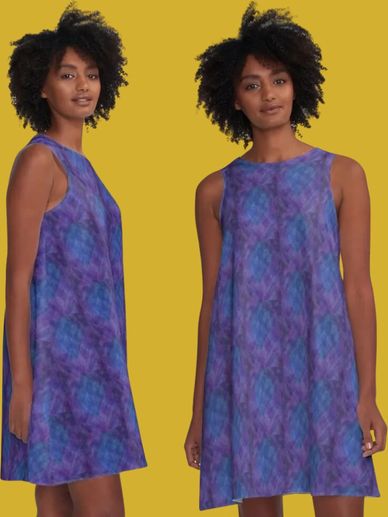 a black women in a sleeveless blue and purple dress