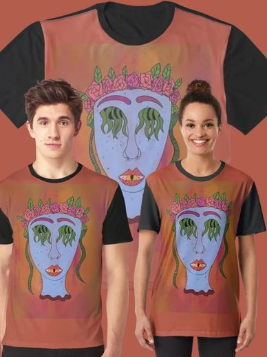 a male and female stand side by side wearing matching shirts of a blue head with vines exiting eyes