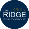 The Ridge Realty Group logo with mountain peaks on a dark blue background.