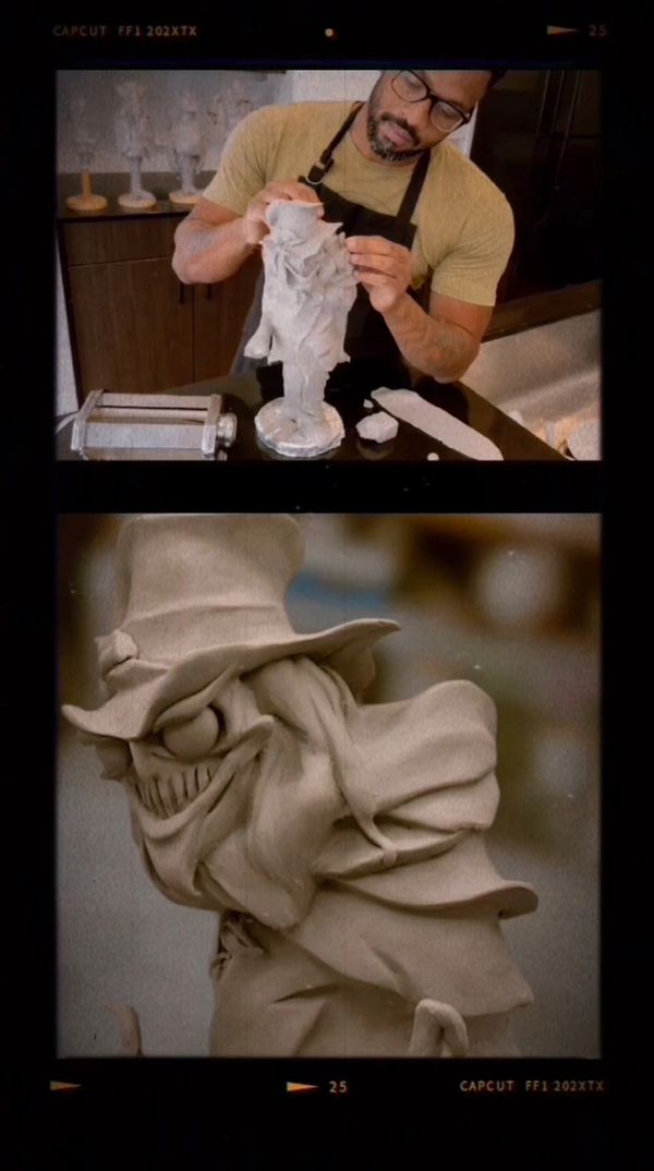 Artist sculpts a detailed, eerie clay figure with a top hat and exaggerated features.