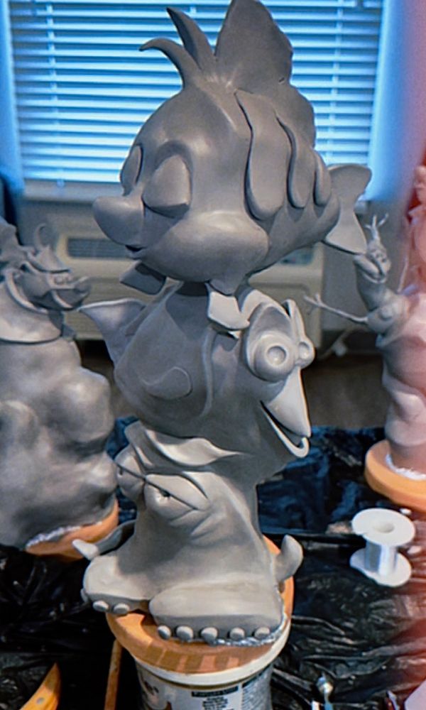 Clay sculpture of stacked animated sea creatures.