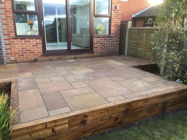 Raised raj green patio area