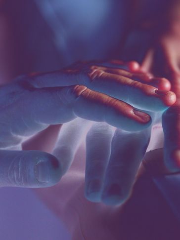 two hands with energy emanating between them