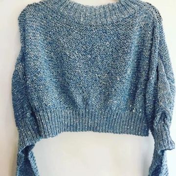 Chunky knit blue sweater with long sleeves and ribbed neckline, hem, and cuffs.