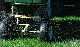 Granular Fertilizer being applied to a lawn from Aaron's Greenscape Inc.