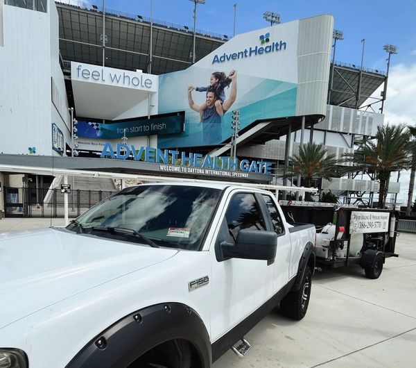 Pressure washing for HOA communities in Palm Coast, maintaining clean sidewalks, pool areas.