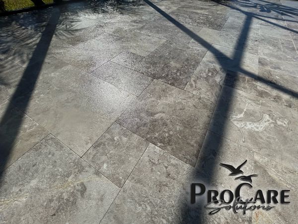 Travertine sealing in Palm Coast, protecting luxury patios with a long lasting natural finish.