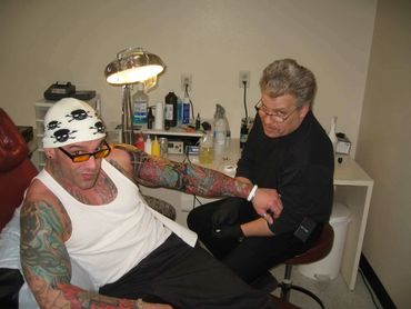 HIV/AIDS survivor Bob Bowers being tattooed at Smooth Fx tattoo shop in Sauk City Wisconsin