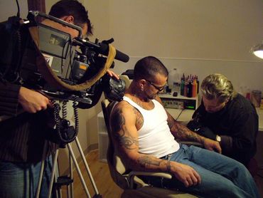 Bob Bowers in the tattoo chair filmed by Mitch Weber channel 27 Madison WI news for Taboo Tattoo