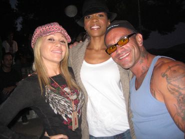 Singer EG Daily and Michelle Williams from Destiny's Child with Camp Heartland volunteer Bob Bowers