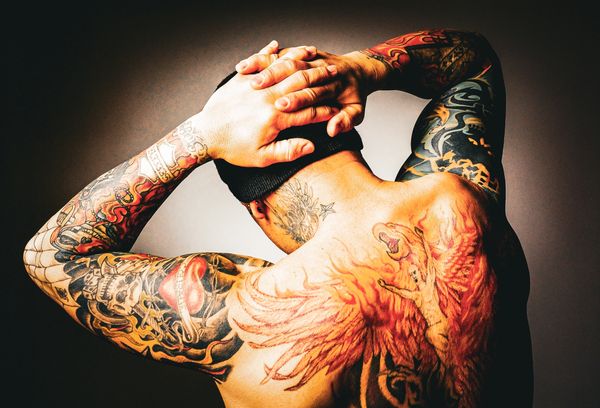 Bob Bowers phoenix tattoos back piece long term HIV/AIDS survivor advocate educator activist Texas