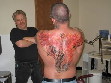 Phoenix tattoos large back piece on HIV/AIDS survivor Bob Bowers by Smooth Fx tatoo Sauk City WI