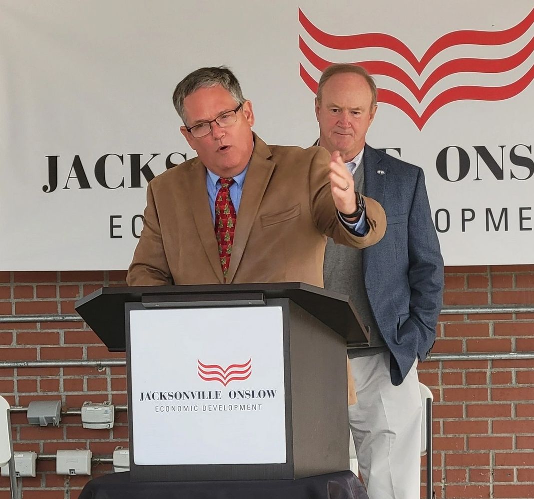 Commissioner Bennett speaking at podium Jacksonville Onslow Economic Development Meeting