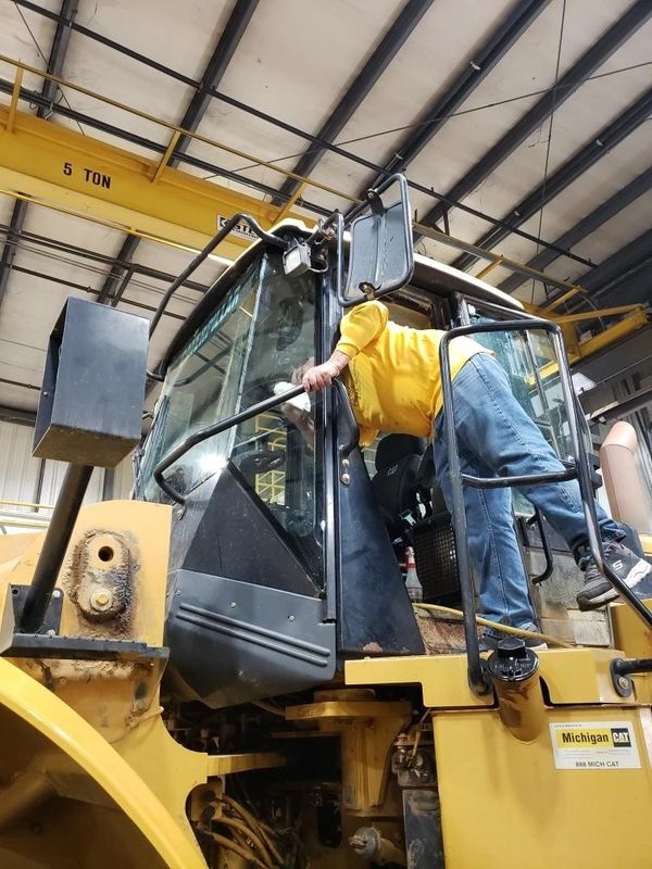 a person going inside an excavator