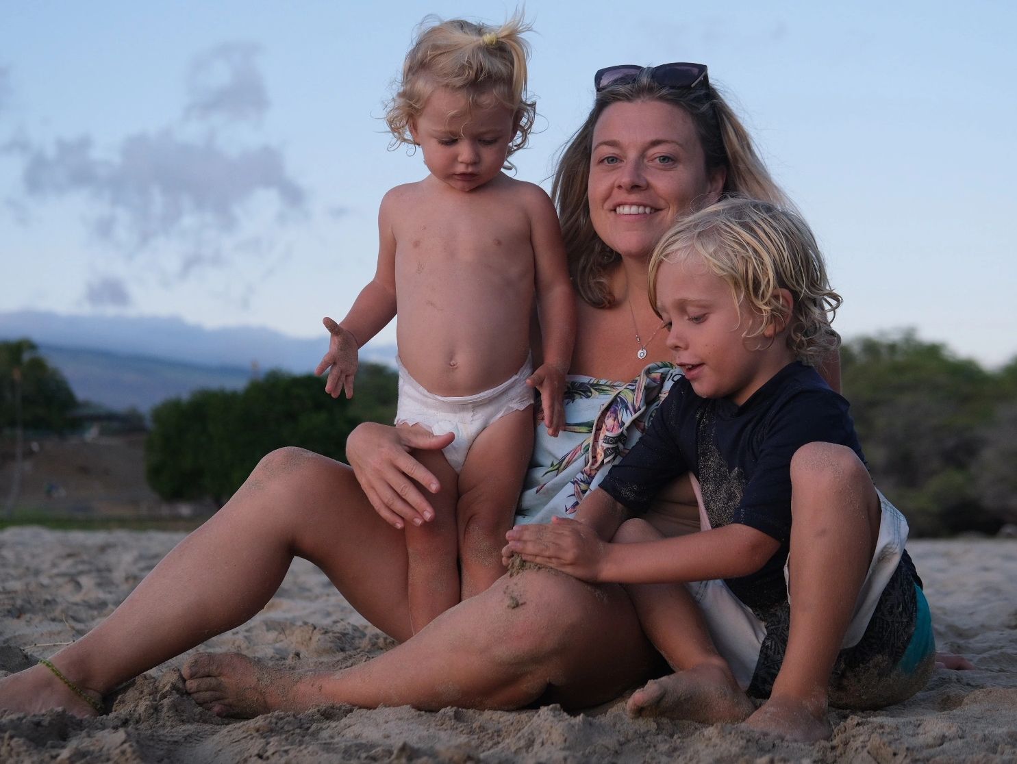 Mom with two kids at beach