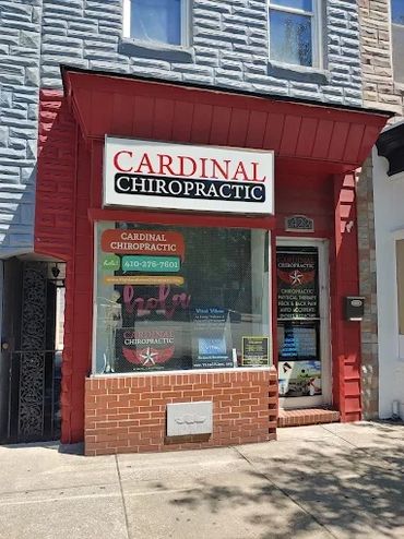 Storefront of Cardinal Chiropractic with signage and contact information.