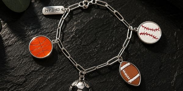 Sports-themed charm bracelet with basketball, baseball, football, and soccer charms.
