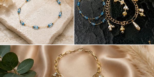 Three gold and blue beaded bracelets with pearl charms.
