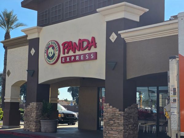 Exterior view of a Panda Express restaurant on a sunny day.